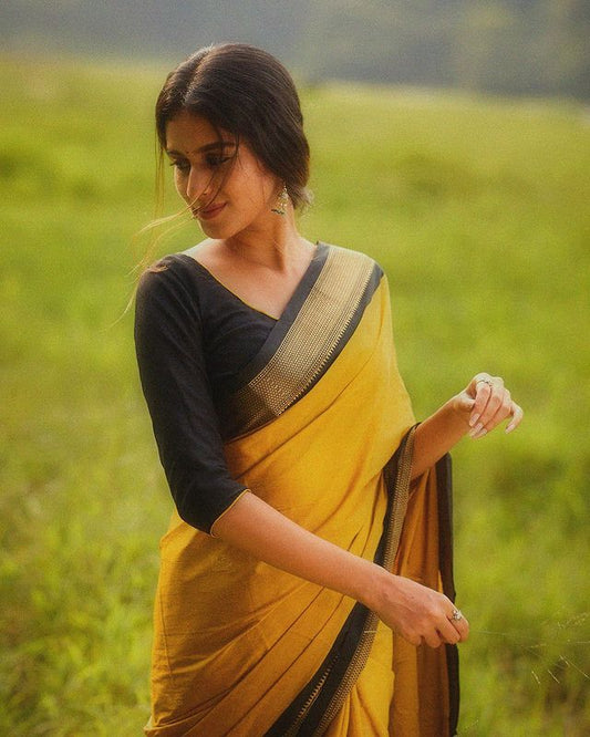 Graceful Pure Soft Silk Saree in Yellow and Black with Engrossing Blouse Piece