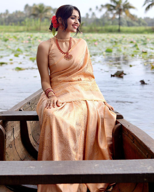 Phenomenal Light Orange Soft Banarasi Silk Saree with Blouse Piece